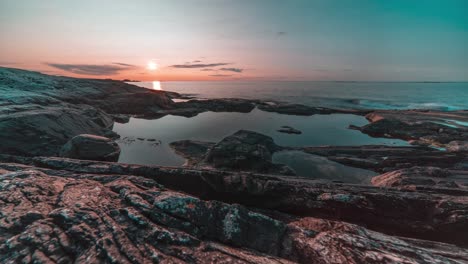 A-timelapse-of-the-beautiful-sunset-over-the-rocky-coast-near-the-Atlantic-road,-Norway
