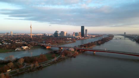 Vienna-Danube-Skyscraper-Skyline-Drone-Video-during-golden-Sunset