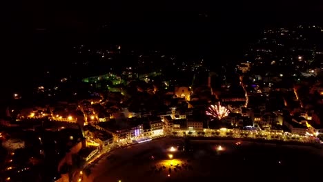Flying--next-to-the-coastline-and-fireworks,-Italy