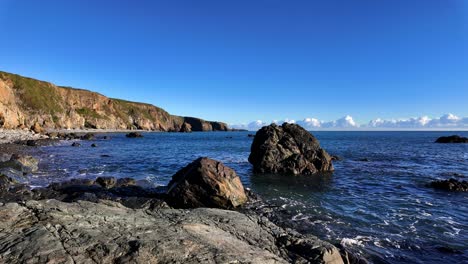 Timelapes-rocks-blue-seas-deserted-beach-and-full-tides-tankards-town-Beach-Copper-Coast-Waterford-Ireland