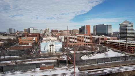 Winter-wilmington-delaware-rising-skyline-drone-shot-snow-on-ground-sunny-cold-day