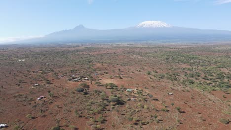 Idyllic-landscape-of-Masai-farmland-an-footstep-of-Mount-Kilimanjaro,-aerial