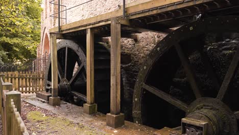Close-up-on-two-hydraulic-wheels-from-a-water-mill