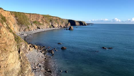 Panorama-of-Tankardstown-Bay-at-full-tide-deserted-beaches-and-tranquility-Copper-Coast-Waterford-Ireland