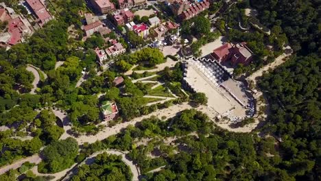 Flying-above-Park-Guell-in-Barcelona,-Spain