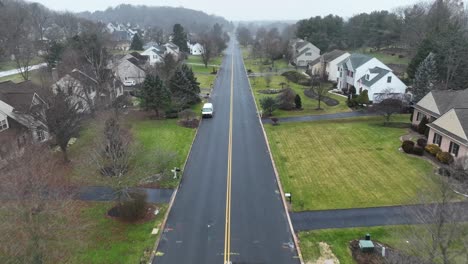 Aerial-flyover-on-a-long-neighborhood-road