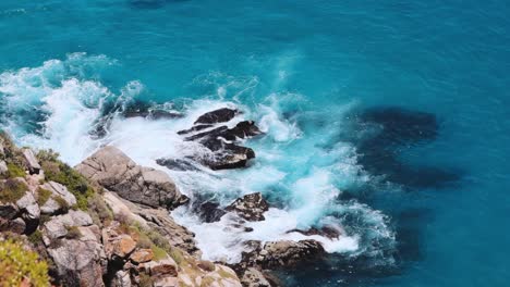 Aerial-View-of-Ocean-Waves-Crashing-on-Rocks