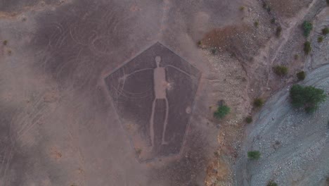 Drone-Hovering-Over-Intaglio-Geoglyph-in-Blythe,-Arizona