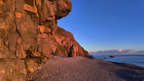 Copper-Coast-Waterford-Ireland-golden-hour-on-remote-pebble-beach-in-stunning-light