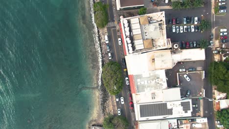 Aerial-of-trafficked-roads-and-houses-by-ocean-in-Lahaina,-Hawaii