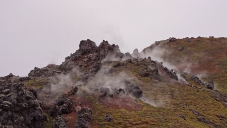 Fixed-view-of-the-solfataras-and-sulfur-fumaroles-in-front-of-Brennisteinsalda-in-Landmannalaugar,-Iceland