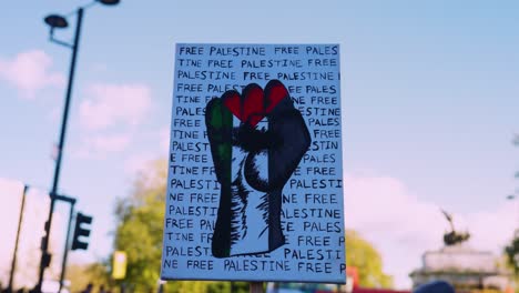 'Free-Palestine'-with-clenched-fist-placard-held-by-activist-at-National-protest-march