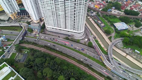 Aerial-Top-Down-View-of-Traffic-on-Highway-1-Jalan-Kuching-in-Kuala-Lumpur-City,-Malaysia