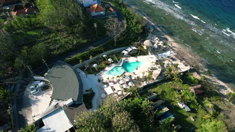 Luxury-Pool-Club-in-Nusa-Penida-Island,-Indonesia---Aerial-Top-Down-Parallax
