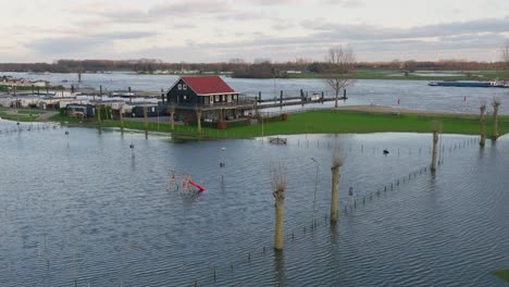Flooded-campsite-on-banks-of-river-Lek-in-Utrecht,-Netherlands