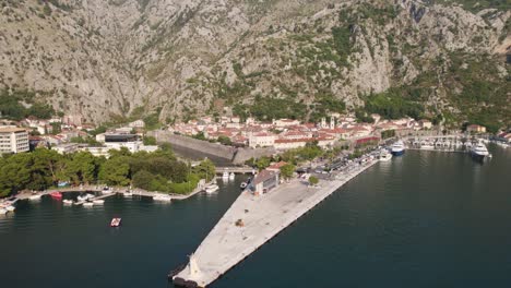 Aerial-orbit-around-empty-port-of-Kotor-in-Montenegro-on-a-sunny-summer-day
