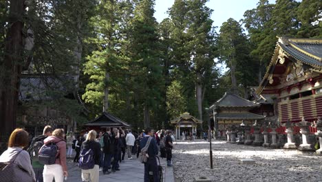 International-tourists-crowd-around-the-pagoda-at-the-Nikko-Toshogu-shrine-in-Japan