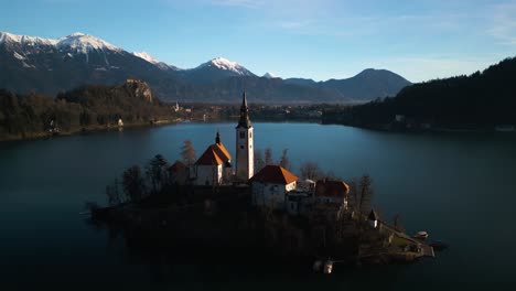 Drone-Flies-Above-Bled-Island-in-Lake-Bled,-Slovenia