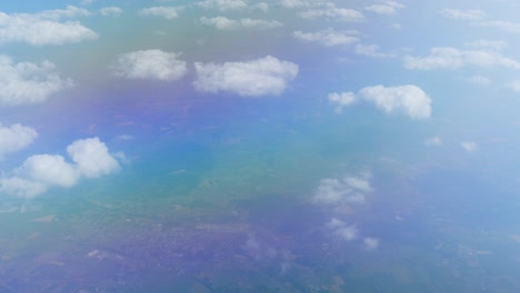 Aerial-View-of-Tenerife-Landscape-from-Airplane-Window-Above-Clouds
