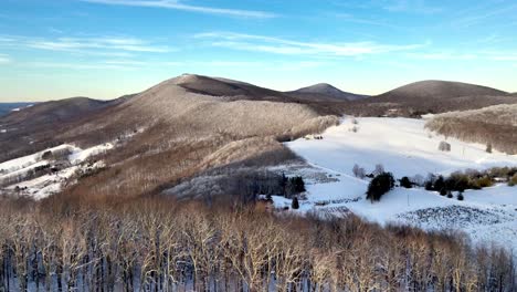 appalachain-mountain-snow-scene-aerial-reveal-near-boone-nc,-north-carolina