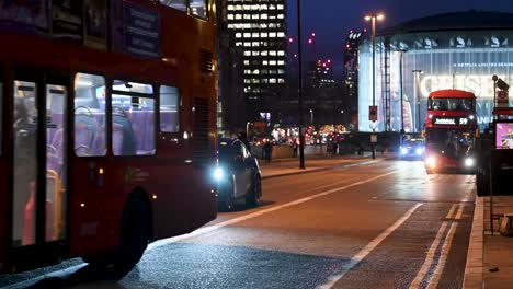 TFL-Buses-driving-towards-London-over-Waterloo-Bridge,-London,-United-Kingdom