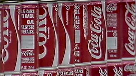 1980S-COKE-CANS-ON-STORE-SHELVES-WITH-SLOW-ZOOM-OUT-OF-OTHER-SODAS