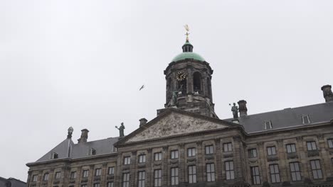 Scenic-low-angle-tilt-of-the-Royal-Palace-in-Amsterdam-during-cloudy-day