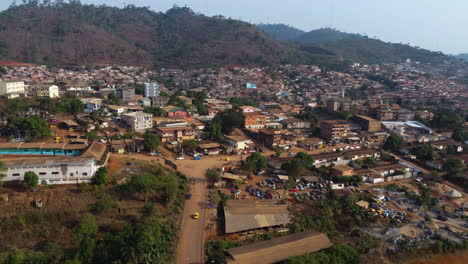 Panoramic-drone-shot-of-the-Cite-Verte-district-of-Yaounde,-sunny-day-in-Cameroon