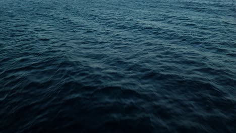 Mysterious-dark-blue-ocean-water-of-the-deep-sea-with-textured-current-ripples