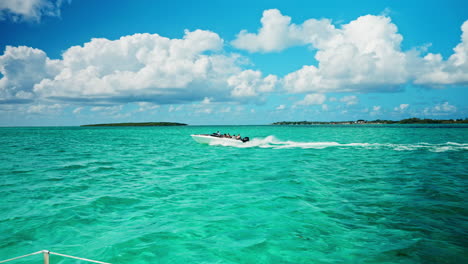 Slow-motion-of-boat-speeding-on-tropical-ocean-heading-towards-the-Ile-aux-Fouquets