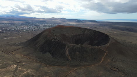 Aerial-dolly-establishes-Honda-Calderon-Volcano-with-epic-cinder-cone-in-Fuerteventura