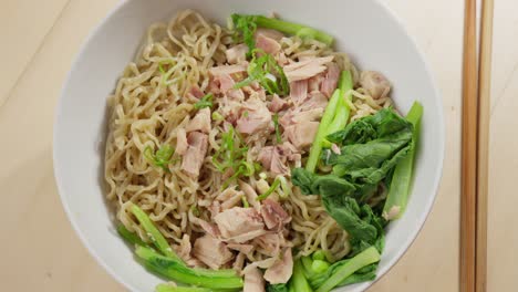 Bowl-of-Bakmi-wheat-noodles-derived-from-Chinese-cooking-tradition