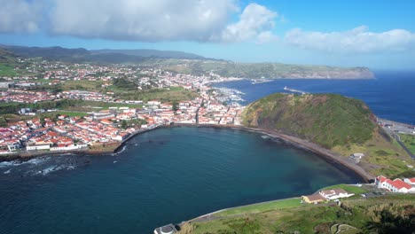 Aerial-tilt-down-shot-revealing-the-whole-bay-of-Horta-in-front-of-Porto-Pim-and-Monte-Queimado