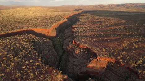 Canyon-intersection-at-Dales-Gorge-during-sunset-in-Karijini-National-Park-in-Western-Australia,-aerial-high-altitude
