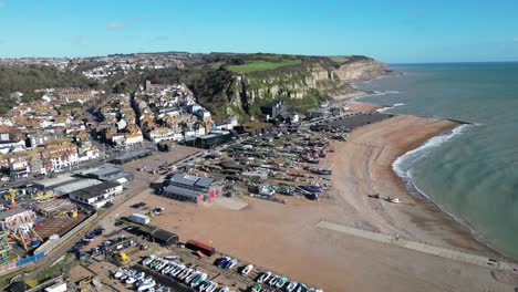 Aerial-drone-shot-of-Hastings-UK,-High-Wide-Angle-Shot-of-Beach,-Old-Town-and-East-Hill-Cliffs