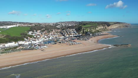 Aerial-drone-shot-of-Hastings-UK,-High-Wide-Angle-Shot-of-Beach,-Old-Town-and-East-Hill-Cliffs