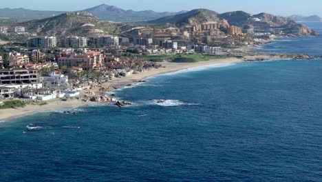 Cinematic-scenic-view-of-the-Sea-of-Cortez-in-Los-Cabos,-beachfront-over-Cabo,-Mexico,-aerial-view