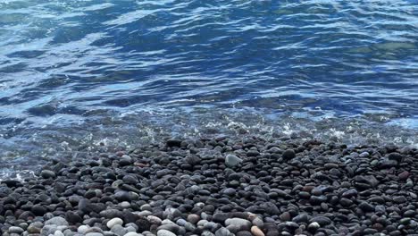 Beach-waves-washing-on-pebble-stone-beach-Tenerife-South-Spain