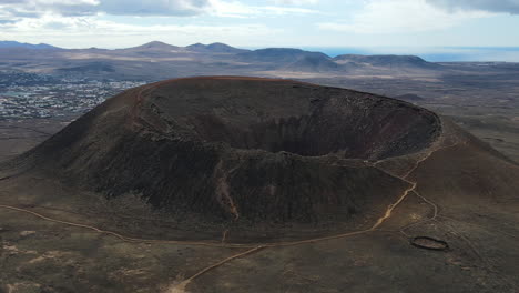 Zoom-out-aerial-view-of-the-Volcano-Calderon-Hondo-in-Fuerteventura-Spain