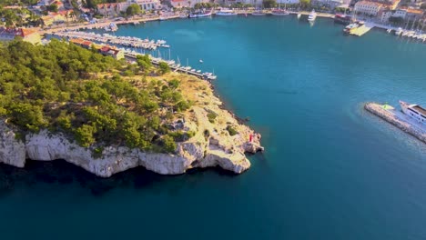 Aerial-Drone-Footage-From-Sea-To-The-Port-Of-Lukobran-Makarska,-Croatia