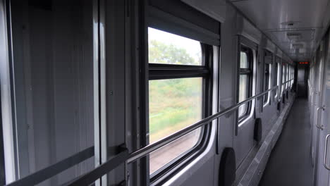 Empty-hallway-inside-a-fast-moving-Ukrainian-Railways-Ukrzaliznycia-train,-4K-shot