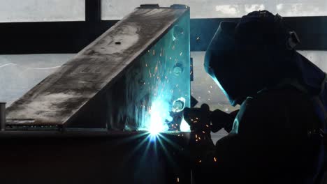 Crafting-brilliance:-Dive-into-the-sparks-and-skill-as-a-welder-shapes-metal-in-this-mesmerizing-stock-footage-snippet