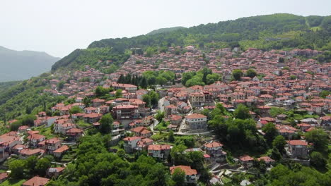 Aerial-view-of-the-mountain-village-Metsovo-in-Greece-on-a-glaudy-afternoon-in-summer