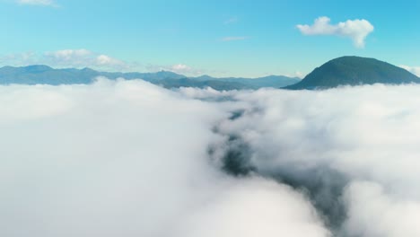 Sea-of-Mist-in-Mueang-Khong-Chiang-Dao-Chiang-Mai-Pai-Huai-Nam-Dang-National-Park,-Thick-Cloud-Layer-on-a-Beautiful-Clear-Day,-Aerial-Drone