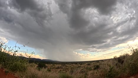 Timelapse-that-captures-the-dynamic-evolution-and-graceful-dance-of-rain-clouds-across-the-stunning-African-landscape-of-the-dry-Southern-Kalahari