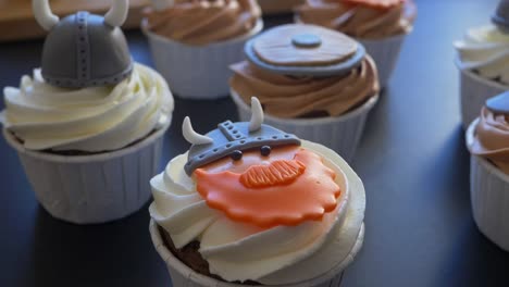 Circling-shot-over-viking-theme-cupcakes-with-Selective-focus,-Slow-motion