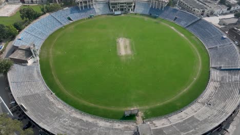 Parallax-aerial-shot-of-cricket-stadium-of-Gujranwala-in-Punjab,-Pakistan