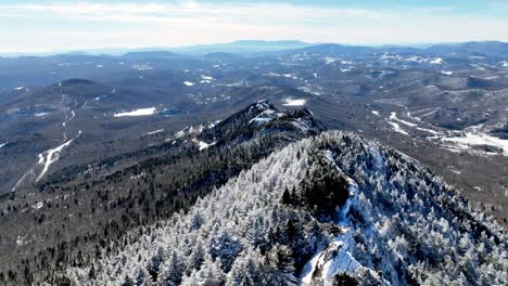 aerial-pullout-over-snow-and-rime-ice-atop-grandfather-mountain-nc,-north-carolina