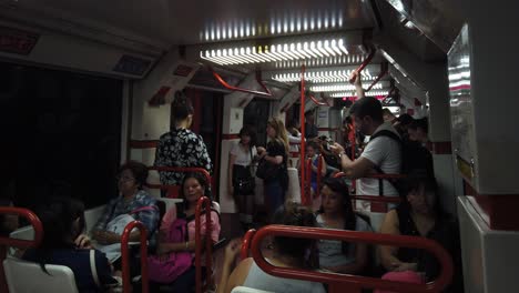Argentine-People-travel-inside-Underground-Subway-Wagon-of-Red-Line-B-Vintage-Cinematic-Lighting