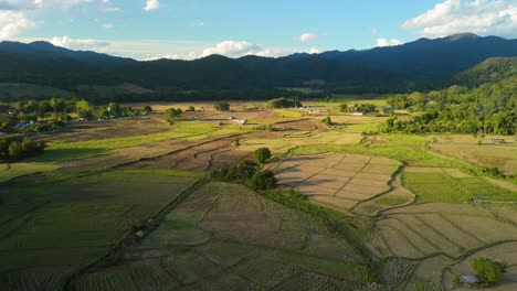 Beautiful-Sunny-Mountain-Valley-with-Golden-Rice-Fields-after-Harvest,-Local-Ecological-Agriculture-and-Traditional-Farming-in-the-Remote-Highlands-,-Vietnam-Thailand-Philippines-Laos